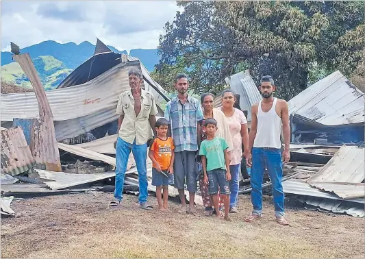  ?? Picture: SUPPLIED ?? Rahmat Ali, left, with his family at the site of their burnt house in Mullau, Rakiraki earlier this month. The National Fire Authority (NFA) recorded four residentia­l fires and a road accident rescue response in the past 72 hours in the Central, Eastern and Western divisions.