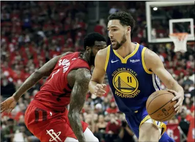  ?? ERIC GAY — THE ASSOCIATED PRESS FILE ?? Golden State Warriors’ Klay Thompson (11) drives past Houston Rockets’ Iman Shumpert during the first half of Game 6 of a second-round NBA basketball playoff series in Houston, May 10, 2019.