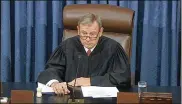  ?? ASSOCIATED PRESS ?? Chief Justice of the United States John Roberts listens during the impeachmen­t trial of President Donald Trump in the Senate on Wednesday.