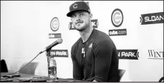  ??  ?? Kris Bryant arrives at Cubs spring training camp Saturday at Sloan Park in Mesa, Arizona.