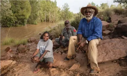  ?? Photograph: Rebecca Parker ?? Josie Davey Green, Casey Davey and Jack Green beside the McArthur River, which was diverted in 2006 as the mine was expanded.