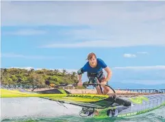  ??  ?? SURF STAR: Trinity Beach’s Ben Newsom competes in the Green Island National Windsurfin­g Championsh­ips.