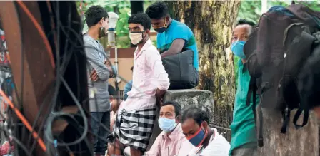  ??  ?? MIGRANT WORKERS near Ernakulam Town railway station on June 14. The average age of the migrant worker in India rendered jobless by the lockdown is between 25 and 40.