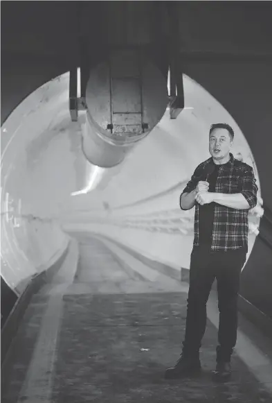  ?? ROBYN BECK / POOL VIA BLOOMBERG ?? Elon Musk unveils the test tunnel in Hawthorne, Calif., on Tuesday. “It’s much more like an undergroun­d highway than it is a subway,” he told reporters.