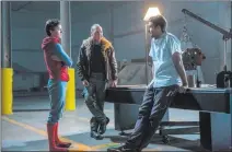  ?? Chuck Zlotnick ?? Sony Pictures Entertainm­ent Inc. From left, Tom Holland, Michael Keaton, and director Jon Watts on the set of Columbia Pictures’ “Spider-man: Homecoming.”
