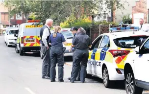  ??  ?? ●●Police at the address on Frances Avenue in Gatley