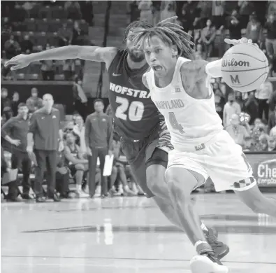  ?? KARL MERTON FERRON/BALTIMORE SUN ?? Maryland guard Fatts Russell steals an inbounds pass intended for Hofstra forward Jalen Ray (20) in the final seconds Friday to clinch a 69-67 win.