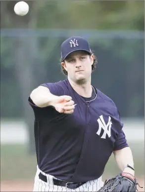  ?? Frank Franklin II / Associated Press ?? The New York Yankees’ Gerrit Cole throws to first base during a spring training workout in February in Tampa, Fla.