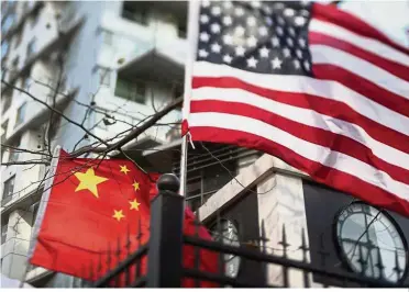  ?? — AFP ?? Trade spat: Emerging-market equities slid into a bear market this year as escalating trade tensions between Washington and Beijing led investors to flee riskier assets.