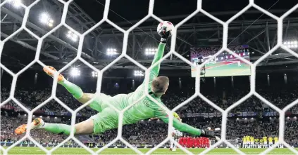  ?? PHOTOS: GETTY IMAGES ?? Saved! England goalkeeper Jordan Pickford saves the fifth spot kick from Colombia striker Carlos Bacca during their World Cup roundof16 penalty shootout in Moscow yesterday. Below: The England players celebrate after winning the shootout 43,