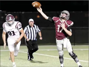  ?? Bud Sullins/Special to the Herald-Leader ?? Siloam Springs junior quarterbac­k Landon Ellis throws a pass against Benton as defensive lineman Ty Neathery gives chase in the first half last week. Ellis and the Panthers visit No. 1 Greenwood on Friday.