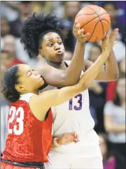  ?? Stephen Dunn / Associated Press ?? UConn’s Christyn Williams (13) steals the ball from Ohio State’s Najah Queenland (23) in the second half of Sunday’s game in Storrs.