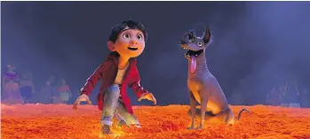  ?? PIXAR/DISNEY/ VIA THE ASSOCIATED PRESS ?? Miguel, voiced by Anthony Gonzalez, and his dog Dante travel to the Land of the Dead in Coco, a new Pixar animated movie based on Dia de Muertos. It hits theatres next month.