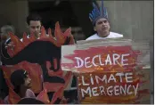  ?? SILVIA IZQUIERDO — THE ASSOCIATED PRESS FILE ?? Activists protest the Australian government’s response to wildfires outside the Australian consulate in Rio de Janeiro, Brazil.