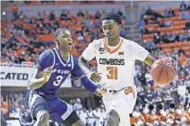  ?? [AP PHOTO/BRODY SCHMIDT] ?? Oklahoma State guard Dee Mitchell (31) advances the ball during the first half of a 69-63 win against Kansas State last season in Stillwater.