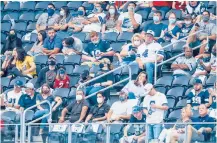  ?? AP FILE ?? Fans, some wearing masks, take in a Cowboys-Falcons game last season in Texas. The NFL says it’s still working hard to ensure the safety of players and fans.