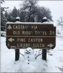  ?? Jeff Zimmerman/For The Signal ?? A snowman sits in front of a snow-covered wayfinding sign Monday in the Grapevine.