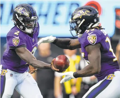  ?? JACOB KUPFERMAN/AP ?? Ravens quarterbac­k Tyler Huntley and running back Gus Edwards are expected to make the cut when the team trims the roster to 53 next week.