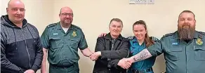  ?? ?? Paramedics accept thanks from Jim Crosswell (centre) after they saved his life