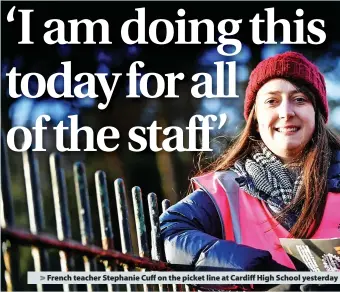  ?? ?? > French teacher Stephanie Cuff on the picket line at Cardiff High School yesterday