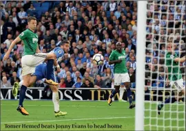  ?? PHOTO: GETTY IMAGES ?? Tomer Hemed beats Jonny Evans to head home