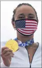  ?? FRANCISCO SECO — AP ?? Carissa Moore of the U.S. holds the gold medal after winning the women’s surfing competitio­n.