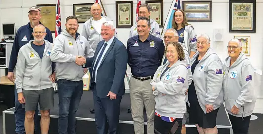  ?? ?? State Veterans Minister Shaun Leane (front 3rd from left) congratula­tes Warragul RSL president Ben Vahland on the success of its RSL Active program during a visit to Warragul last week where he also met and chatted with a number of people involved in the program. (back) Chris Berg, Robert Green, Brett Kerston and Mary Sgarbossa, (front) Mark Buttner, Mr Vahland, head of RSL Active Victoria’s Steve Gilmour, Mike Latimer, Kylie Sage, Merelyn McCarthy and Faye McLachlan.