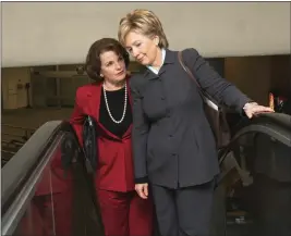  ?? LAUREN VICTORIA BURKE — THE ASSOCIATED PRESS FILE ?? Sen. Hillary Rodham Clinton, D.N.Y., right, talks with Sen. Dianne Feinstein, D-Calif., on Capitol Hill in Washington on their way to vote on Dec. 21, 2005.