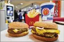  ?? MIKE STEWART / ASSOCIATED PRESS ?? CaliBurger uses “Flippy” to flip and remove burgers from the grill. Could McDonald’s be next?