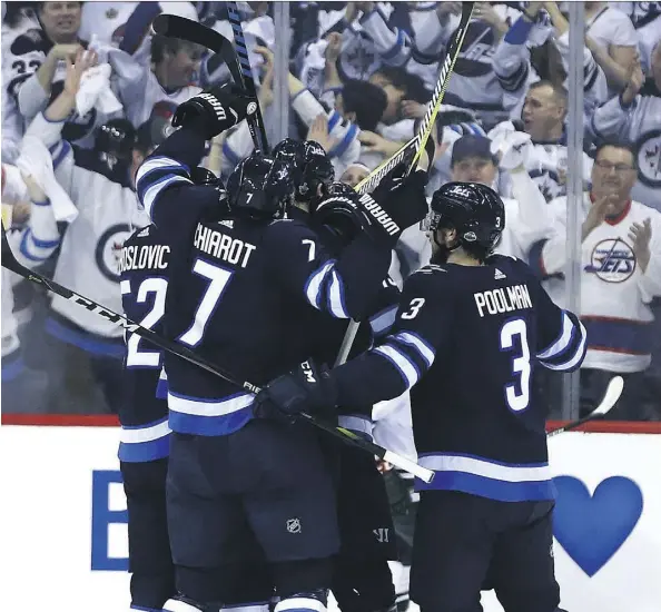  ?? KEVIN KING ?? The Winnipeg Jets celebrated four goals on their first 10 shots in the first period and proceeded to score a 5-0 victory over the Minnesota Wild to win Game 5 on home ice Friday night and clinch their opening-round series, the first series victory for...