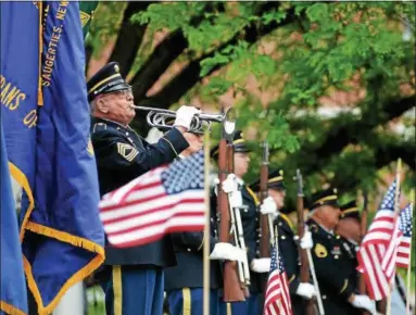  ?? TANIA BARRICKLO — DAILY FREEMAN ?? Joe Forte of Joyce-Schirick Veterans of Foreign Wars Post No. 1386 in the town of Ulster, N.Y., plays Taps during the Kingston Memorial Day Service on the lawn of City Hall.