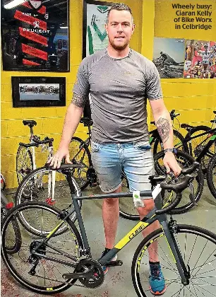  ??  ?? Wheely busy: Ciaran Kelly of Bike Worx in Celbridge