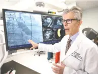  ?? STAFF PHOTO BY TIM BARBER ?? Dr. Larry Shears, chief of cardio-thoracic surgery, talks about surgery procedures in one of the operating suites at the opening of Erlanger’s new Heart and Lung Institute on Thursday.