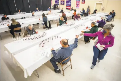  ?? BRIAN FEULNER ?? More than 50 judges gathered at the Cloverdale Citrus Fair to judge over 5,600 North American wines.