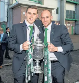  ??  ?? CAPTAIN MARVEL: Paul Hanlon (left) holds the trophy with skipper David Gray