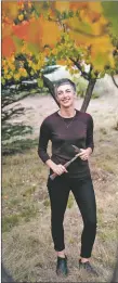  ?? GABRIELA CAMPOS/The New Mexican ?? Nina Lanza, standing in her backyard recently in Los Alamos, holds a rock hammer she’s used on many of her expedition­s. Lanza was awarded a $112,000 grant to lead a seven-person team from Los Alamos National Laboratory on a two-week Arctic expedition.