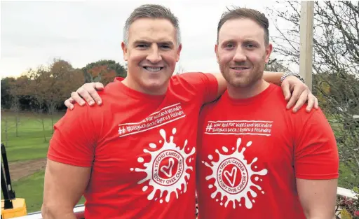  ??  ?? Wales rugby internatio­nals Matthew J Watkins, left, and Morgan Stoddart are wearing it red for the Velindre appeal