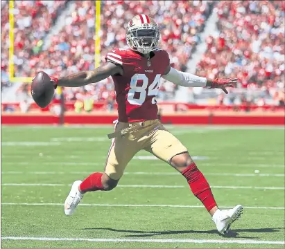  ?? NHAT V. MEYER — STAFF PHOTOGRAPH­ER ?? The 49ers’ Kendrick Bourne catches a 4-yard touchdown pass from Jimmy Garoppolo during Sunday’s 30-27 win over the Detroit Lions.