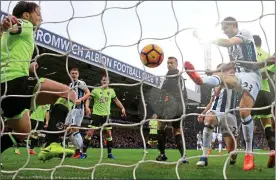  ??  ?? NET GAINS: Gareth McAuley (right) scores West Brom’s second goal as the Baggies continued their impressive home form against Bournemout­h yesterday