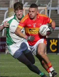  ??  ?? Johnny Keating (Horeswood) racing away from Cormac O’Rourke.