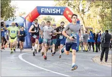  ?? ?? CASA’s Superhero Run on Saturday was a fundraiser to support the services provided by Court Appointed Special Advocates, who help guide foster kids through the system.