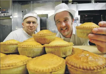  ?? Photograph: Iain Ferguson, The Write Image ?? Nevis Bakery production assistant manager Robert Lawrie, right, and baker Leszek Kotowicz with the award-winning pies.