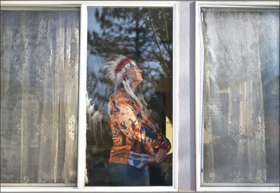  ?? ?? RJ SANGOSTI — THE DENVER POST Martin Knife Chief, a Lakota man who was part of the living history presentati­ons at Bent’s Old Fort, stands for a portrait at his home in Westminste­r on Tuesday. He disagrees with the park service dropping first-person reenactmen­ts.