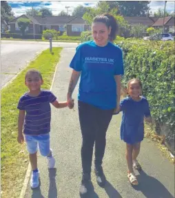  ??  ?? Rae walking her daily steps with son Izaiah and her daughter Isla-Rae