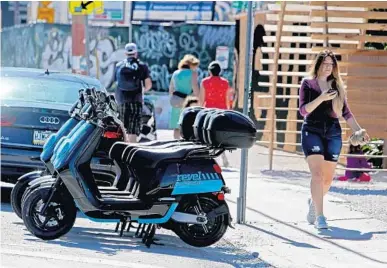  ?? SUSAN STOCKER/SUN SENTINEL PHOTOS ?? New York-based Revel launched its electric moped rentals in Miami in December with customer access through the Revel app.