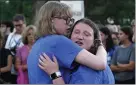  ?? NAM Y. HUH —
THE ASSOCIATED PRESS ?? Jordan Hozman, left, hugs Liza Tack during a vigil Thursday for the victims of Monday's Fourth of July parade attack in Highland Park, Ill.