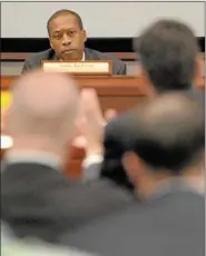  ?? PETER HVIZDAK — NEW HAVEN REGISTER ?? Hamden Mayor Scott Jackson, chairman of the Sandy Hook Advisory Commission, listens to opening remarks by Gov. Dannel P. Malloy during the commission’s first hearing Thursday at the Capitol in Hartford.