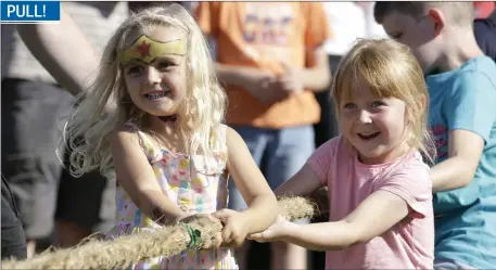  ??  ?? Ayesha Nolan and Indi Condren taking part in the Tug of War at the Roundwood Festival.