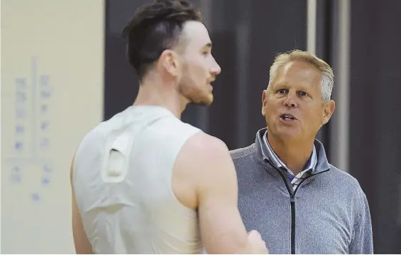  ?? STAFF PHOTO BY CHRISTOPHE­R EVANS ?? MANAGING THINGS WELL: Celtics president of basketball operations Danny Ainge chats with Gordon Hayward during Tuesday’s practice at the Auerbach Center. Ainge has been encouraged by the recoveries of Hayward and Kyrie Irving.