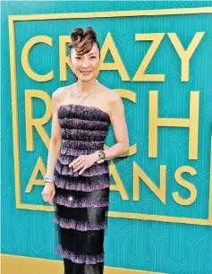  ??  ?? Cast member Tan Sri Michelle Yeoh poses at the premiere for ‘Crazy Rich Asians’ in Los Angeles, California, last month. — Reuters file photo